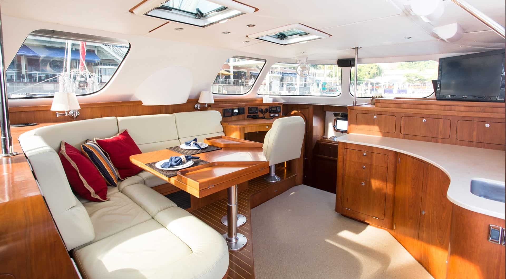 Antares 44 salon interior with cherry wood cabinetry