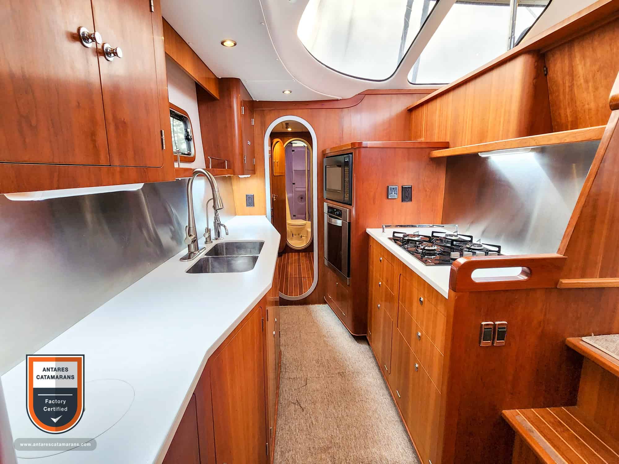 Antares 44 galley with cherry wood cabinets